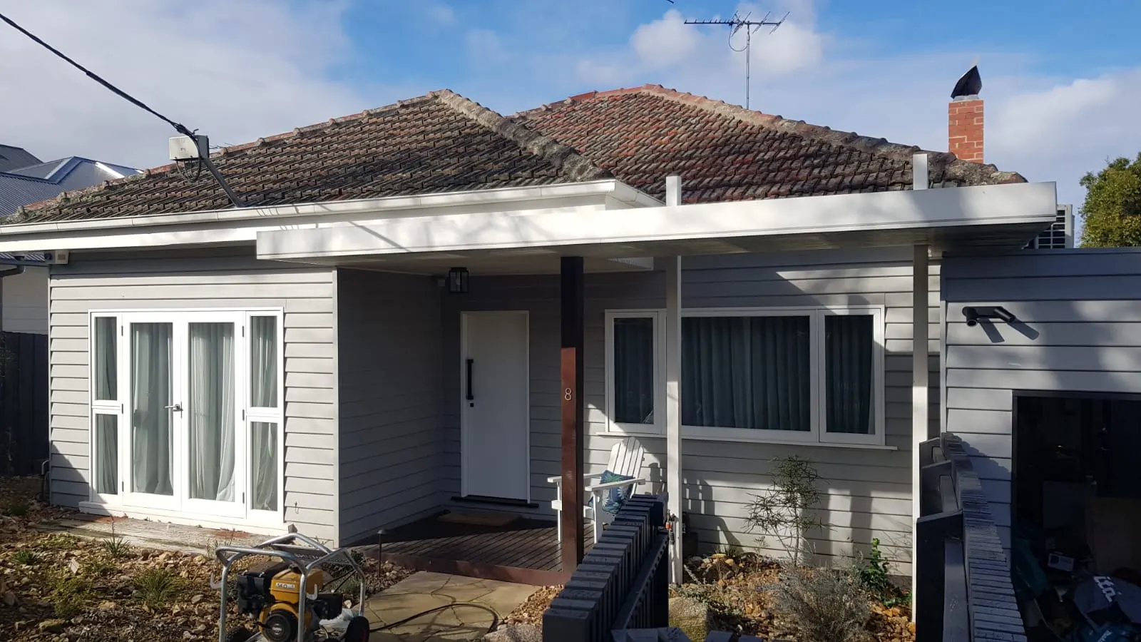 Weathered tiled roof viewed from the front of a Melbourne home